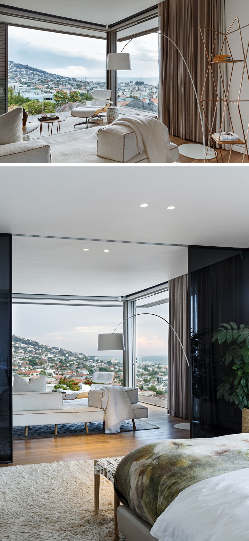 This modern master bedroom has floor-to-ceiling windows with dark curtains that can be closed for privacy.