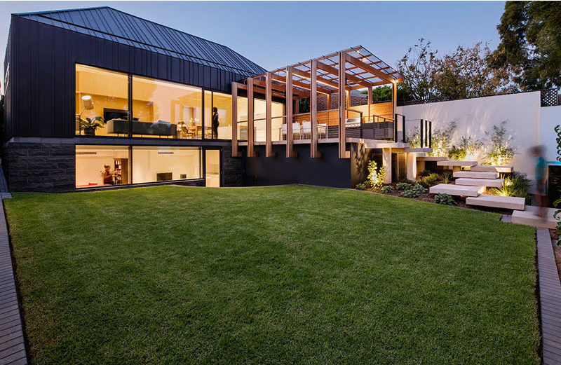 Architecture firm Glasshouse designed a family friendly backyard space with a number of design details like a modern pergola and entertaining deck, and a swimming pool.