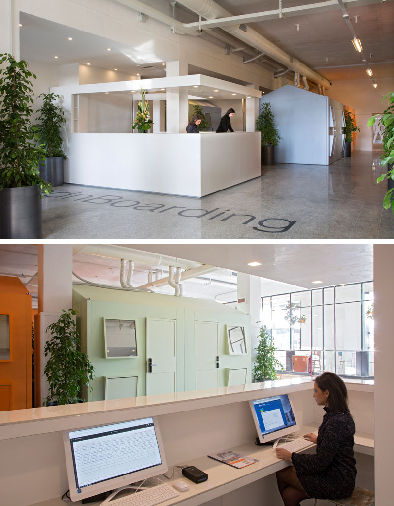 The modern lobby of this short stay hotel in Naples, Italy, has plants to keep the space feeling fresh and welcoming while the large windows let in natural light to keep the space bright.