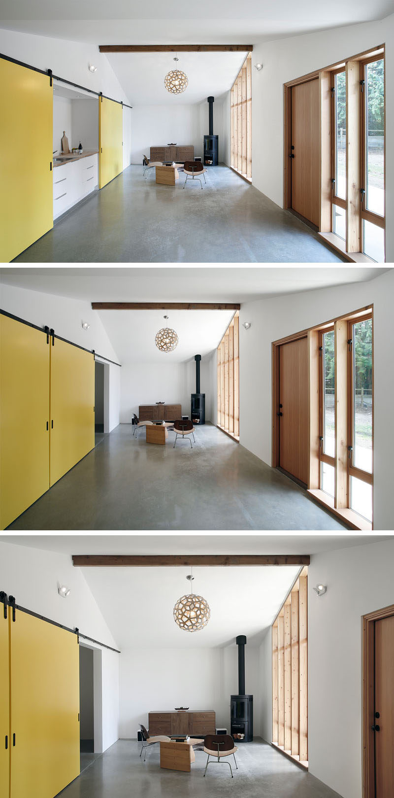 Fun, bright yellow sliding barn doors run the length of this small home and conceal the bedroom and the kitchen, as well as adding a pop of color to the simple interior.