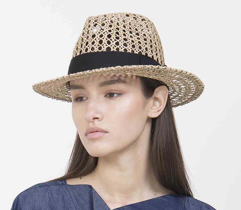 Yael Cohen, a fashion designer based in Israel, has created this Fedora with a black band as part of a collection of modern straw hats that are perfect for summer.