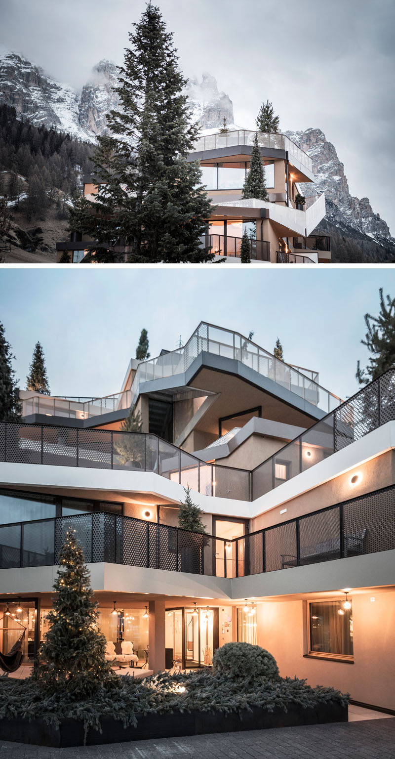 noa* have redesigned Hotel Tofana in Italy, with terraces and balconies are lined with coniferous trees and plants, which are connected by vertical ramps and stairs, creating an illusion of a summit for the hotel. 