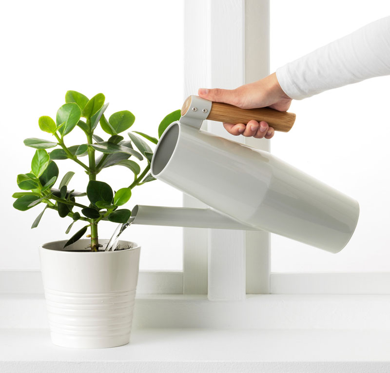 With the wood handle and the soft grey metal, this modern watering can will blend right into a interior full of plants. #Gardening #WateringCans #ModernWateringCan #Plants