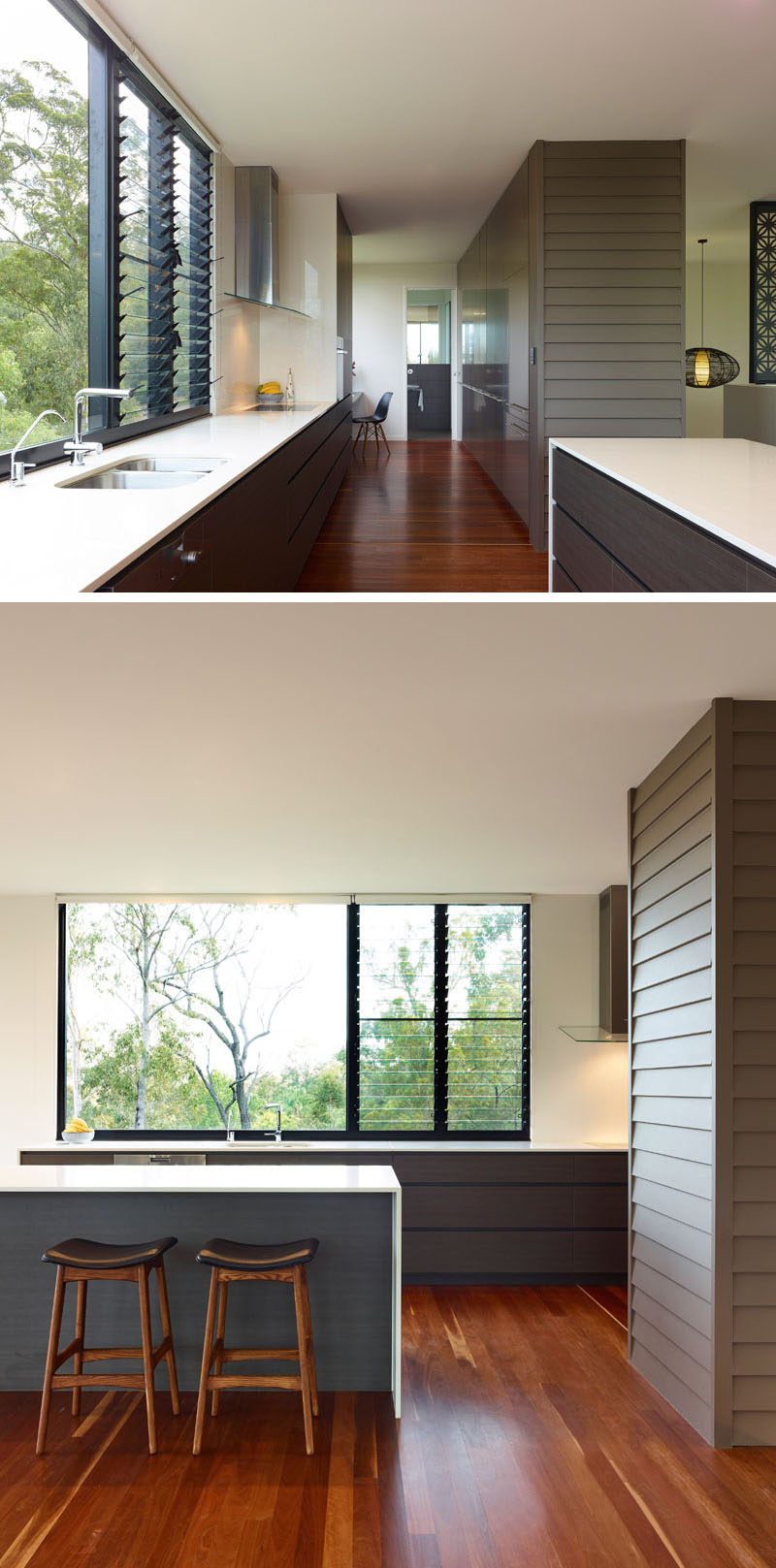 In this modern kitchen, the white countertops help to reflect light and keep the kitchen bright and airy. The use of a kitchen island maximizes productivity and allows for extra seating in the kitchen. 