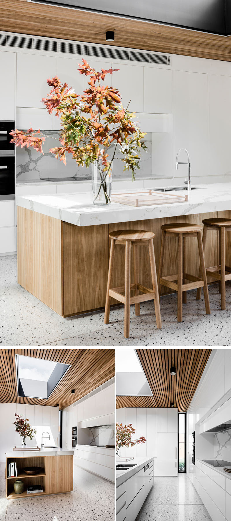 In this modern and bright kitchen, white cabinets are paired with a stone backsplash and countertop, while the light wood island has space for seating and open shelving on one end.