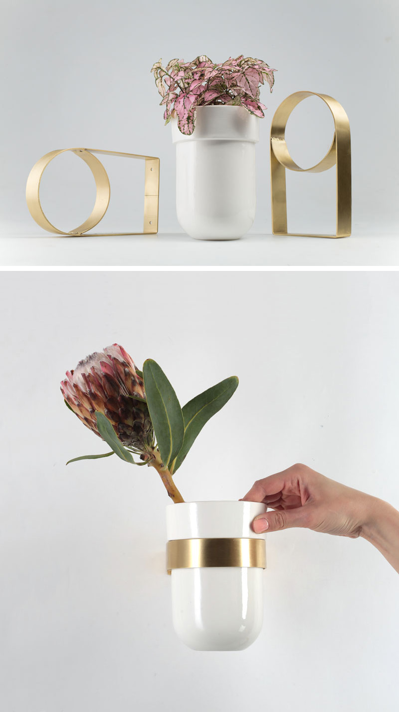 This modern ceramic white vase can be attached to a wall using a special brass wall mount. 