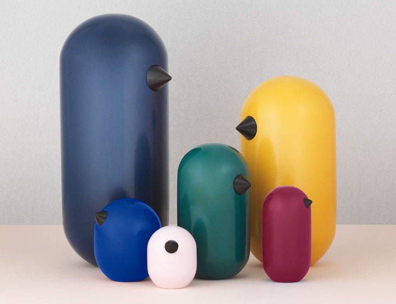 This colorful collection of wood bird figurines are minmalist and modern in design. 