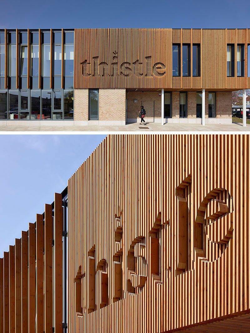 The wood logo on the exterior of this wellness centre has been integrated into the wood siding.