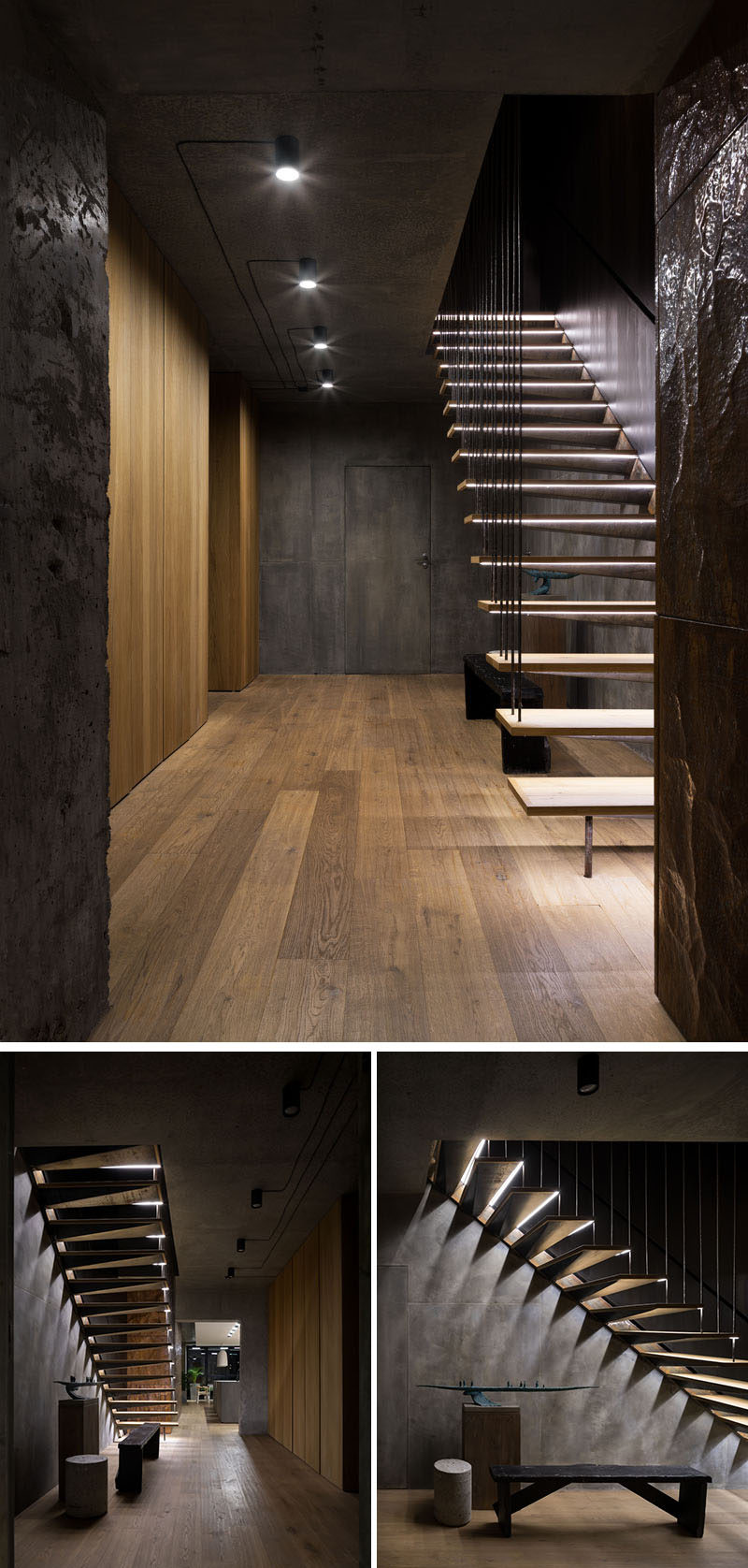 The front hallway in this modern apartment is a mix of concrete and wood which ties into the rest of the home. The hallway is simplistically lit, and each wooden step of the wood and steel staircase leading upstairs is individually lit.