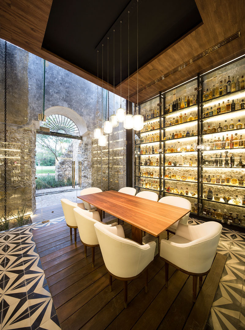 This modern restaurant inside a renovated farm building has a private dining room for small gatherings. Walls of backlit shelves highlight the various bottles on display.