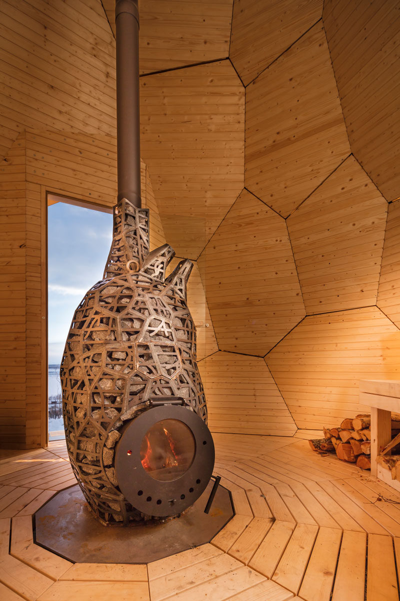 Inside this egg shaped sauna, multi-level wood seating with hidden lighting and patterned wood walls surround the fireplace. The fascinating egg can accomodate up to eight people at once. 