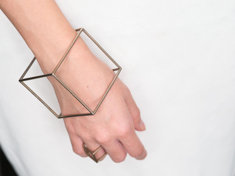 Printed using stainless steel powder, this 3D printed bracelet comes out looking like a perfect silver cube. #ModernJewelry #Fashion #Style