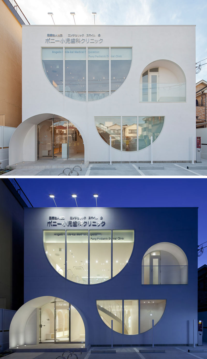 The windows of this white dental office building are playful, with the curved shapes continuing on through to the inside of the clinic. 