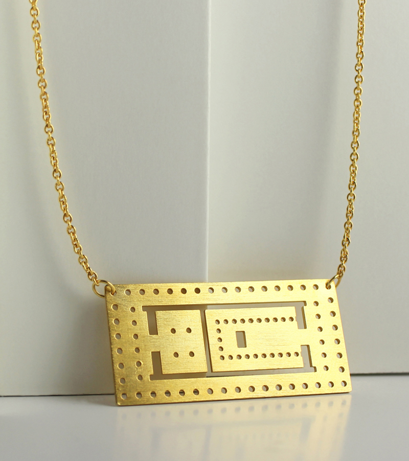 This modern necklace was inspired by the Parthenon, a temple that was dedicated to the goddess Athena.