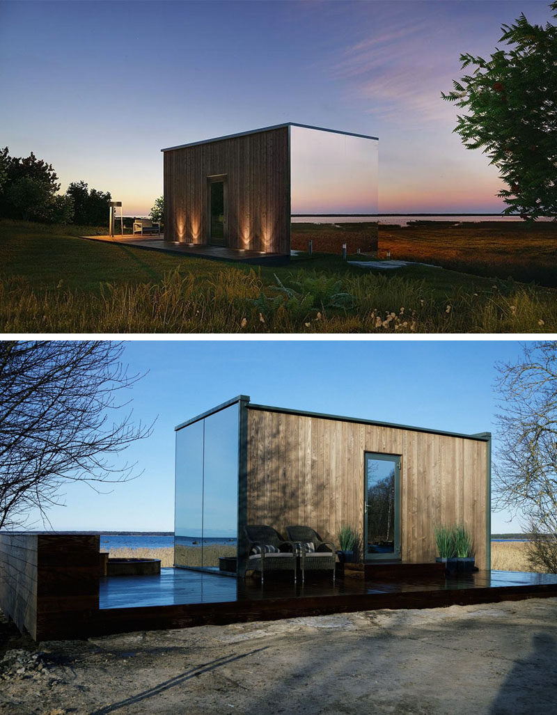 Prefabricated mirrored glass on three sides of this modern home reflect the surrounding areas, making the house blend in with nature. The front entrance can be found at the back of the home, which is made from wood. 