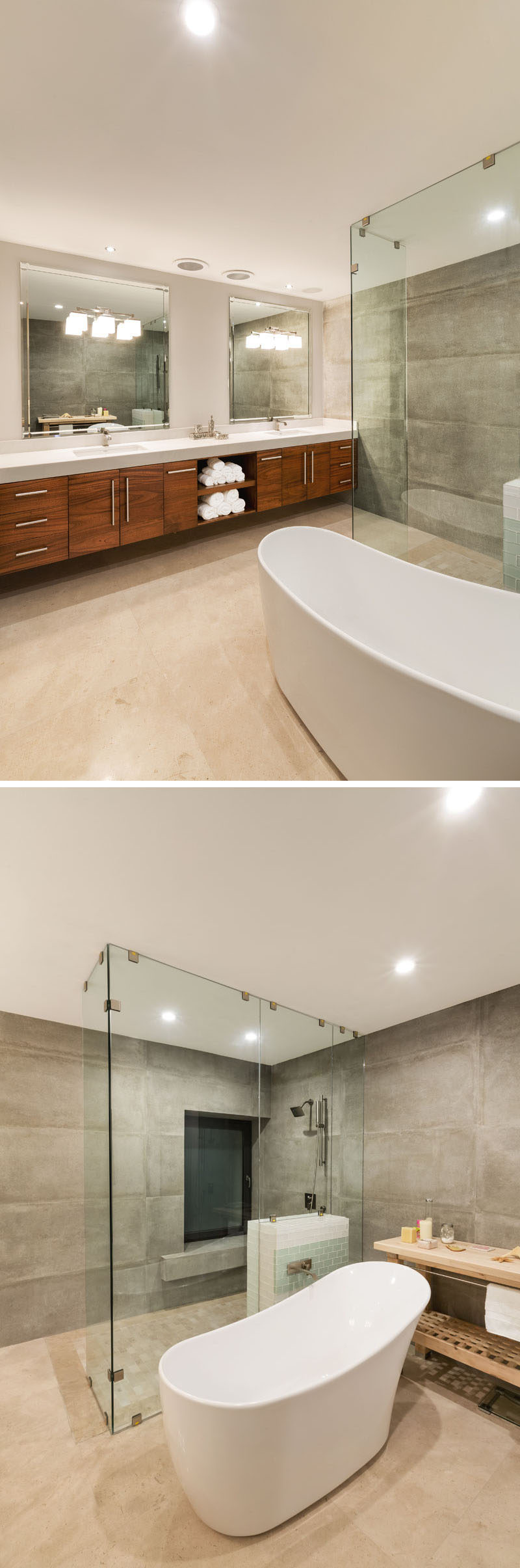 In this newly updated modern bathroom, marble tiles on the walls were removed and replaced by imported porcelain tiles. The bathtub is central to the bathroom, while the shower has a floor-to-ceiling glass surround, and a large wood vanity with dual sinks runs the length of one wall. Large mirrors help to reflect the light throughout the room.