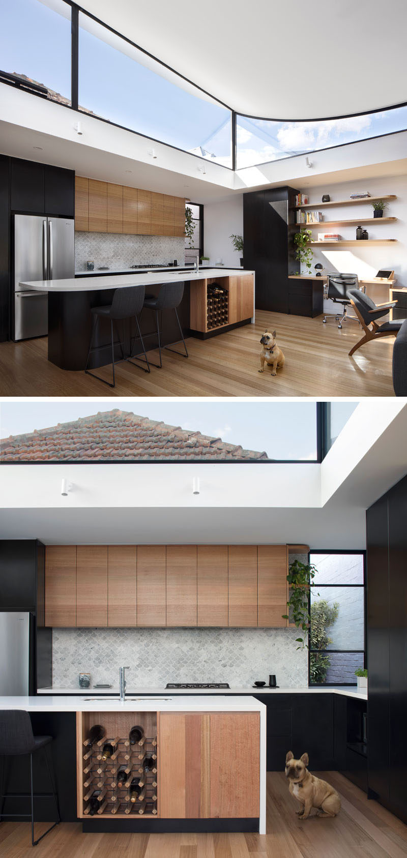 In this modern kitchen, the black and wood cabinets are paired with white countertops and a light grey fish scale patterned tile. A built-in wine rack is included in the design of the kitchen island, and at the end of the upper wood cabinets, curved corner shelves tie in with the shelves above the desk.