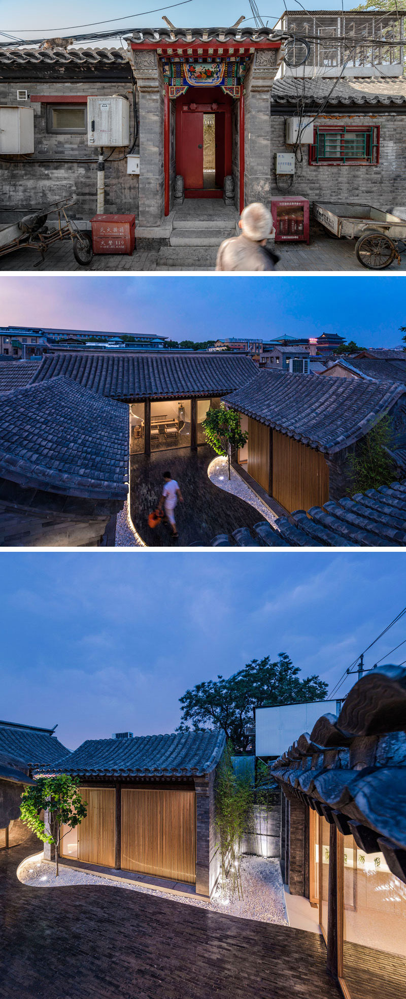 This unassuming red door guides you to a modern interior, where you walk through a narrow pathway that opens up into an interior courtyard with multiple buildings surrounding it.