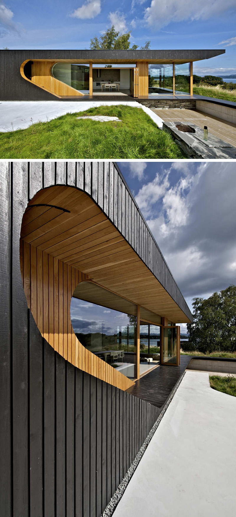 The curved window of this modern cabin follows the shape of the exterior, and reveals the interior of this black wood cabin.