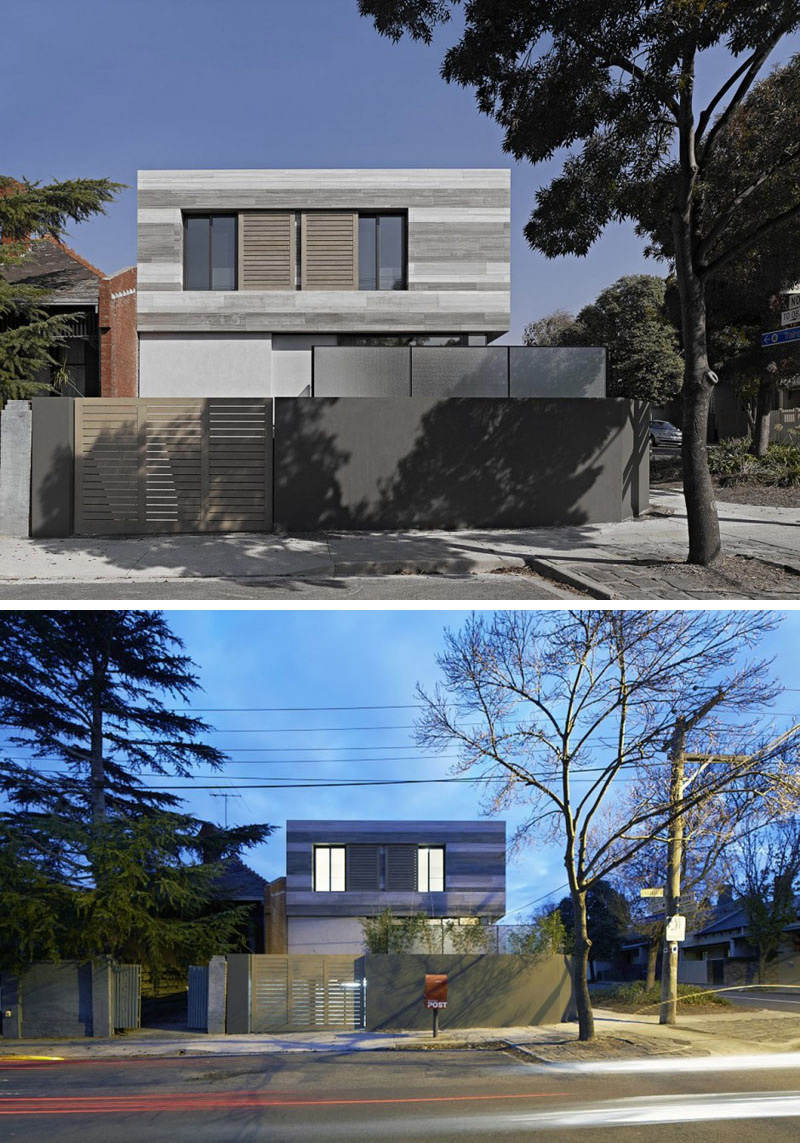 Placed on the corner of the neighbourhood, this modern house can be seen from various angles. A wood gate provides entry to the garage. 