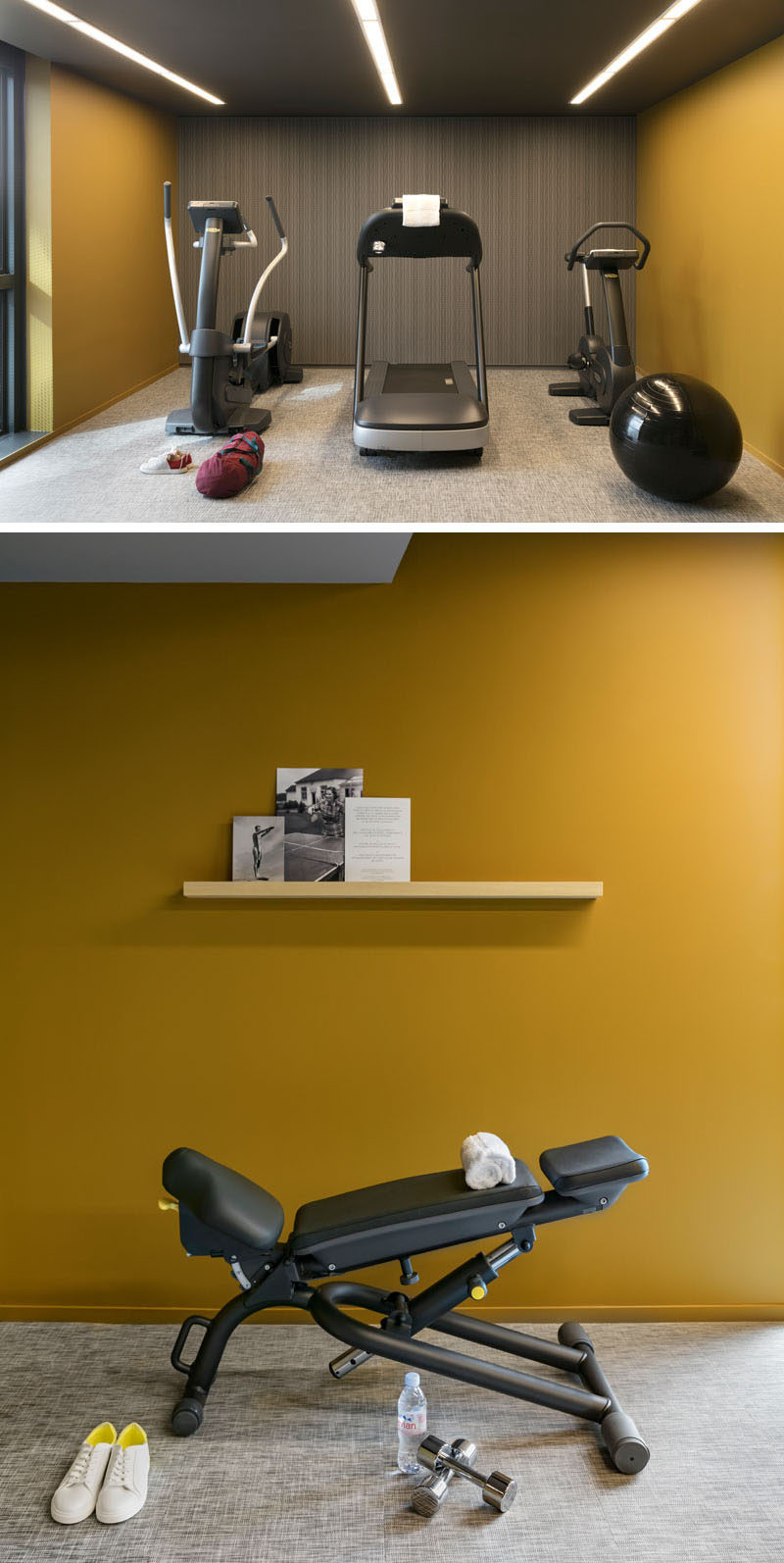 This modern hotel gym has a simple interior with bold colored walls and strips of lighting in the ceiling.