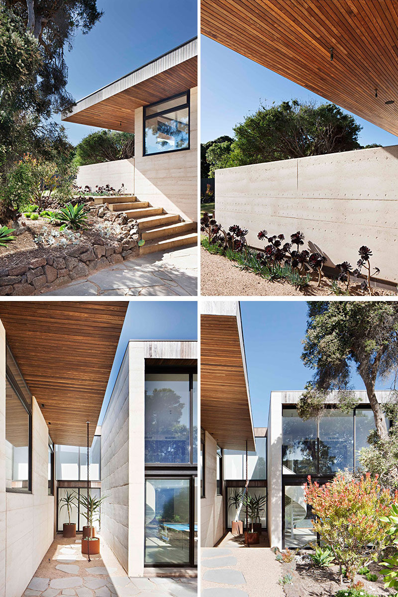 The two main building materials of this modern house are rammed earth for the walls, and timber used for the overhanging roof.