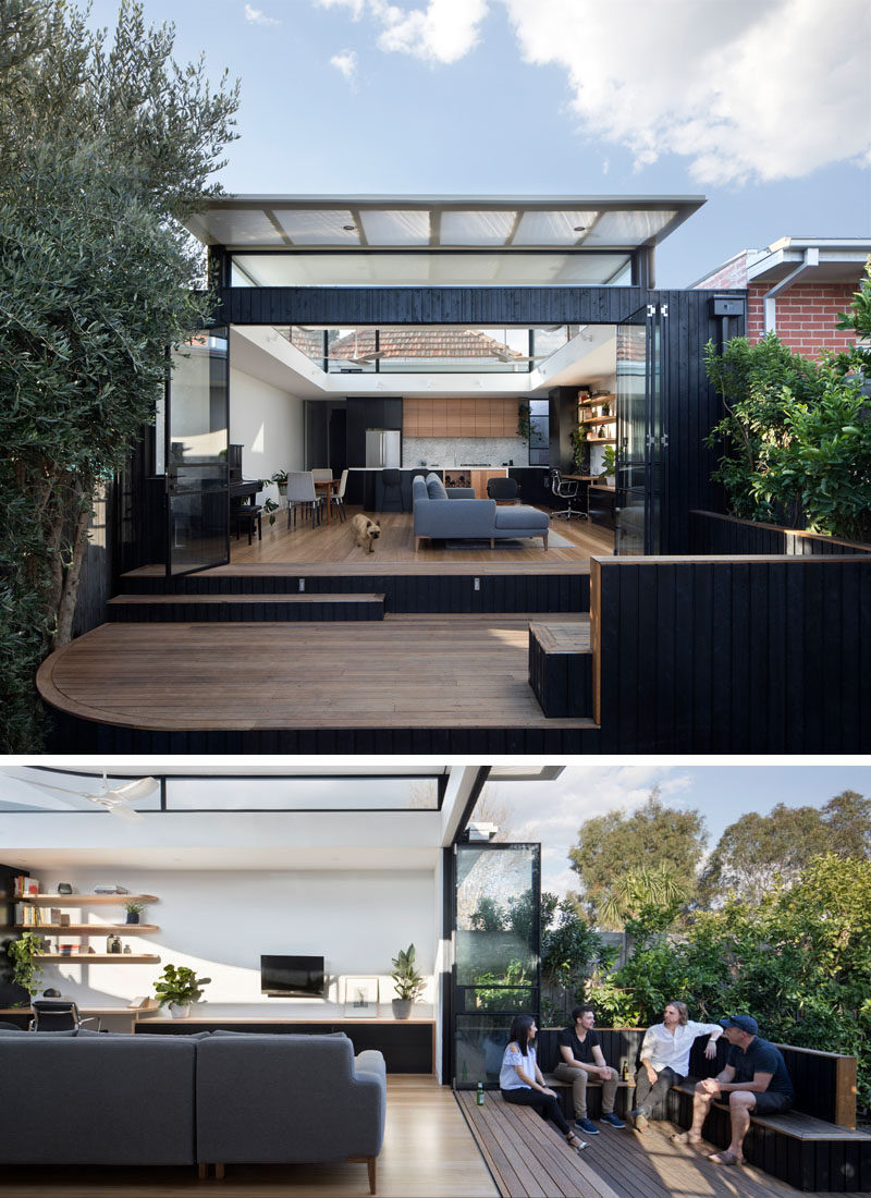 Ben Callery Architects have recently completed a contemporary extension to a brick house in Melbourne, Australia, that's home to a new open plan living space with a home office, dining area and kitchen, and opens out onto a wood deck with built-in seating.