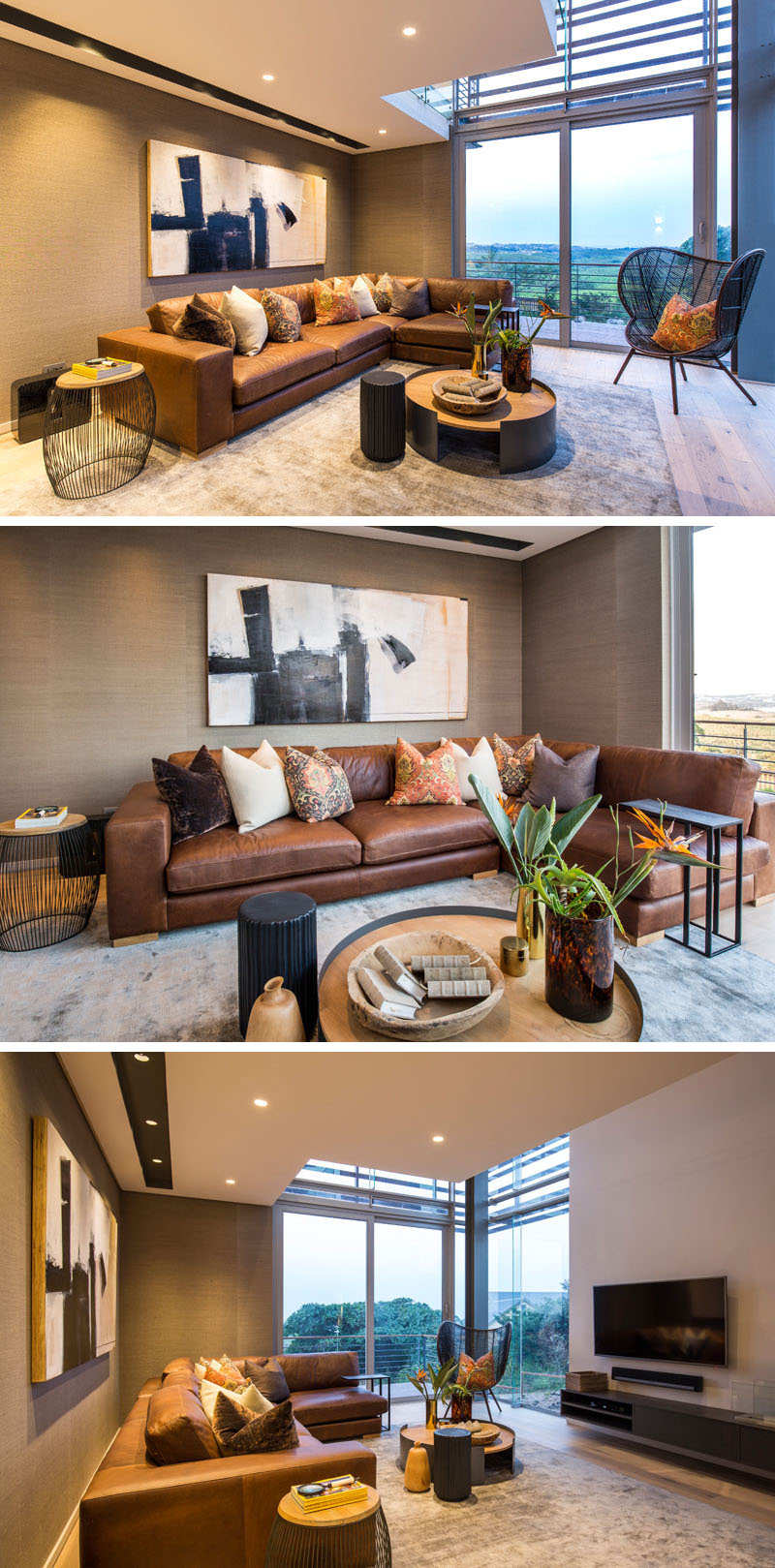 This modern living room, has a large L-shaped, brown leather couch and a black detailed chair provide seating. Warm earth tone colors used in the decor and fabrics, compliment the mounted art piece above the couch.