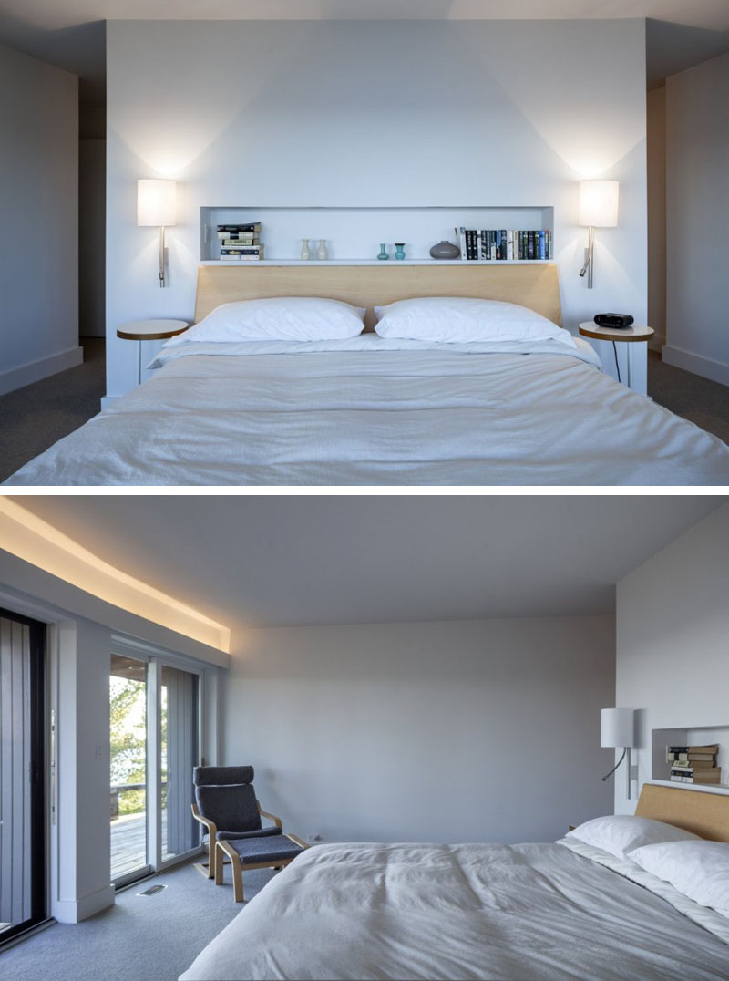 In this modern master bedroom, a built-in shelf above the bed provides an excellent space for books and small ornaments. Two wall mounted lamps provide reading light and sit above two wood nightstands. For extra light, hidden lighting is used again above the sliding glass doors in this room.