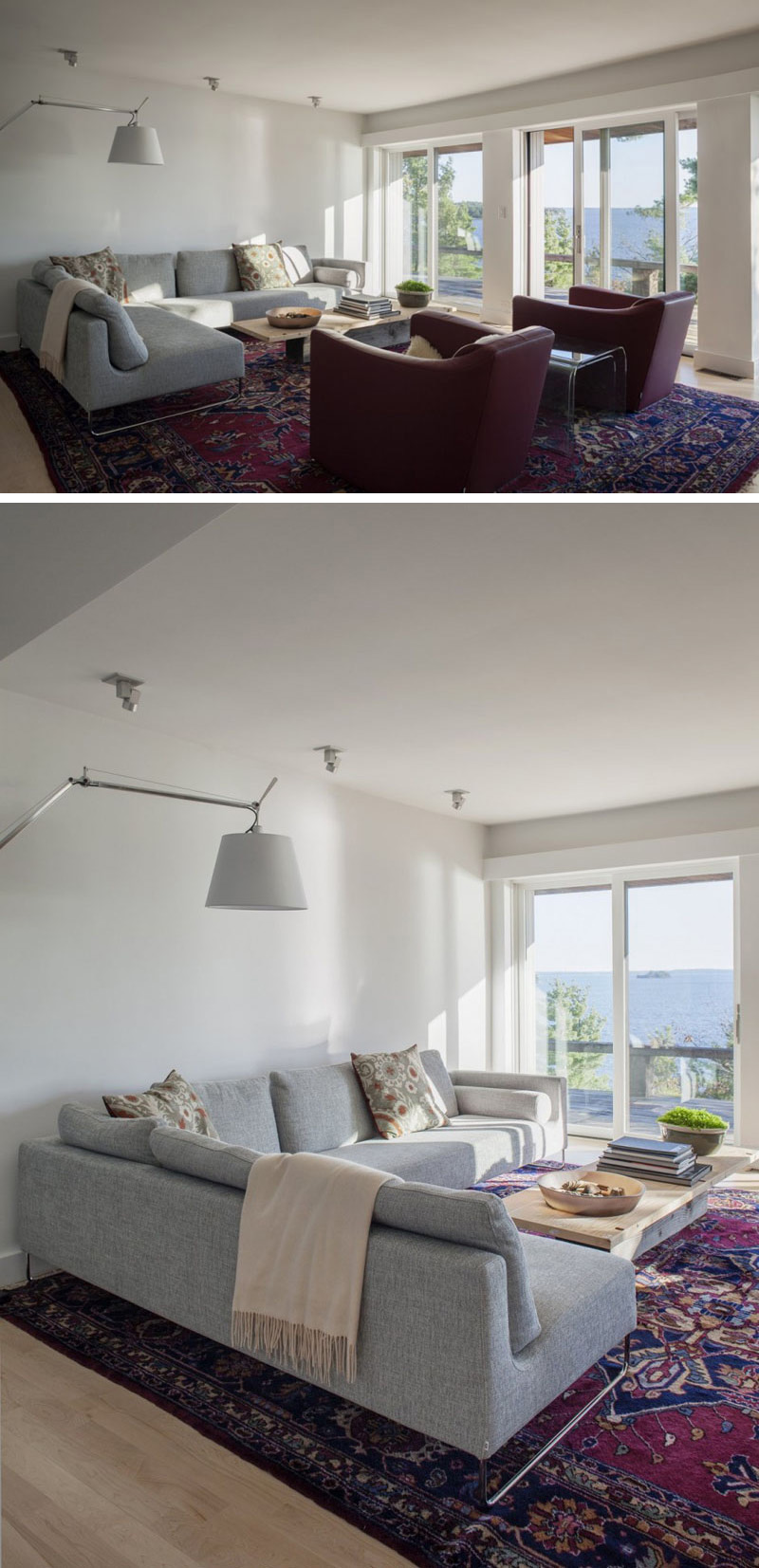 In this modern living room, a grey upholstered L-shape couch, and two red sofa chairs sit beside sliding glass doors that lead to the balcony. A large red Persian rug is placed on the wood floor to make the room a comfortable place to relax.