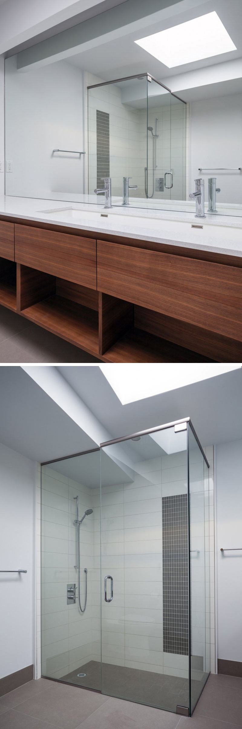 In this modern master bathroom, an undermount sink with dual faucets sits below a large mirror. A skylight in the ceiling makes the white room even brighter, while a glass shower surround allows the light to travel into the shower.