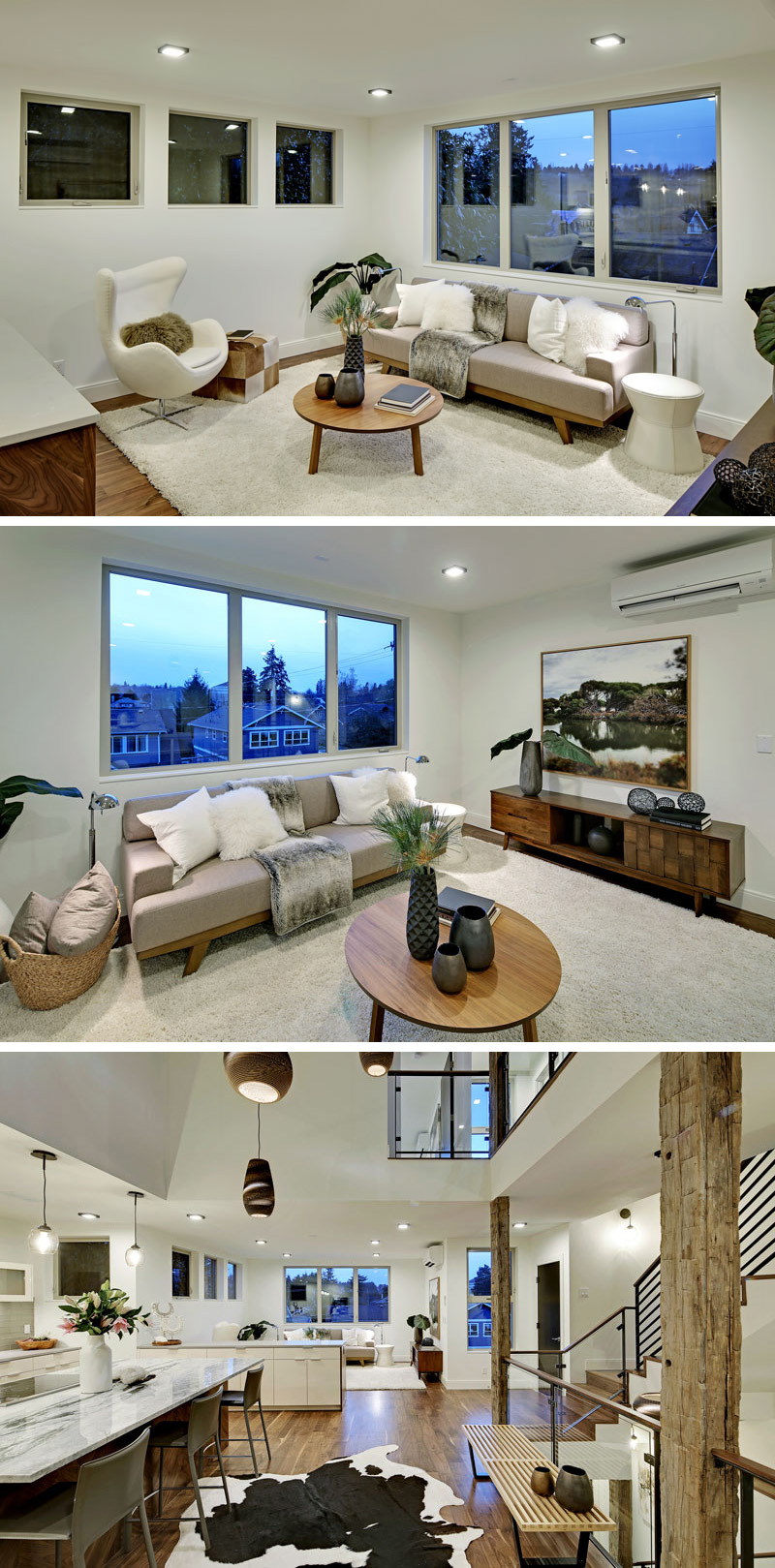 Going through the main floor of this modern home, the living room is decorated in whites and soft greys. A large white area rug has been placed on the solid walnut wood floor, which is used throughout the home.