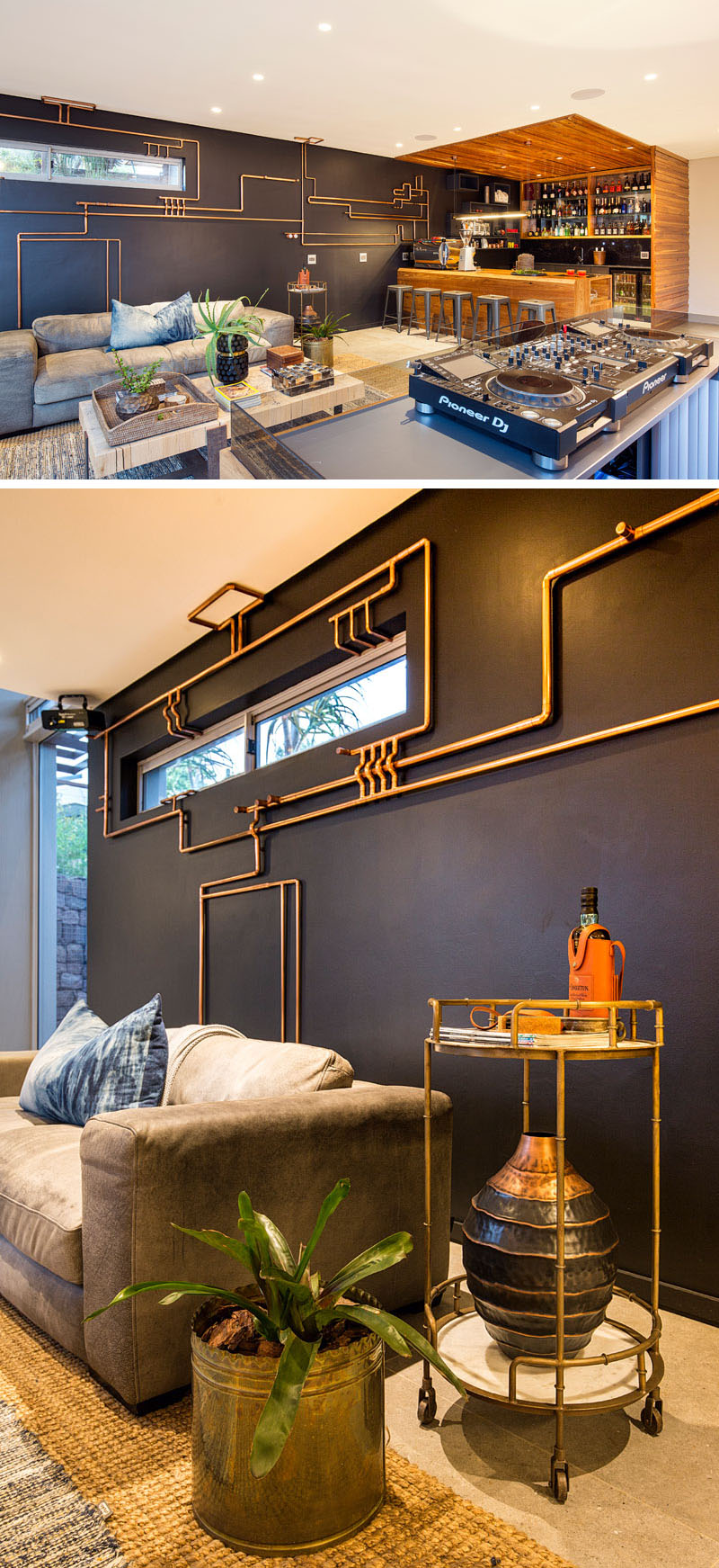Steampunk inspired, exposed copper piping stands out on the black accent wall in this modern space. A customised DJ booth faces a grey upholstered couch, where guests can soak up music and drinks.