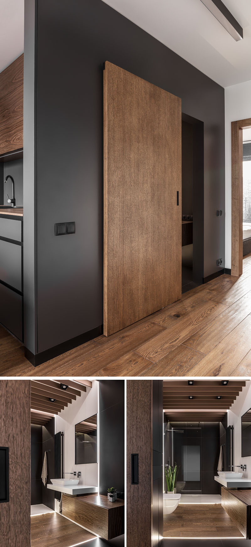 A sliding wood door defines this modern bathroom, while hidden lighting has been used in the floor, creating a soft glow and lighting up the mostly dark room. 