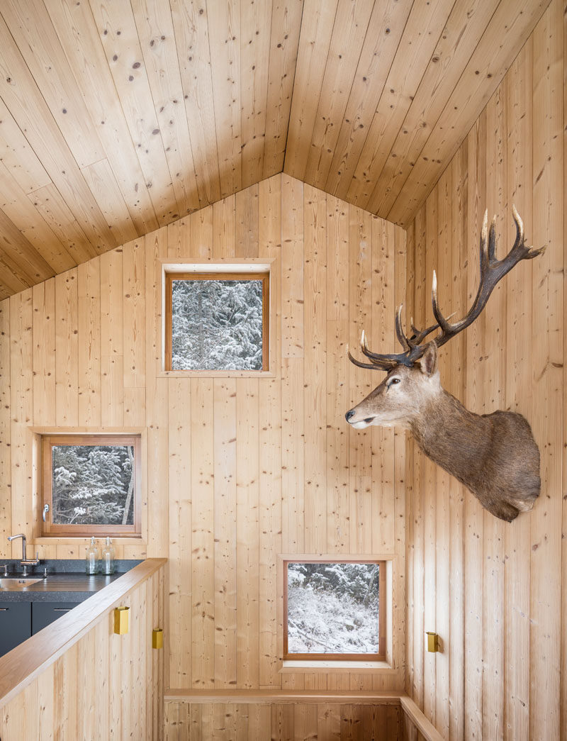 Heading to the top floor of this modern mountain home, you realize that there's a vaulted ceiling, creating a sense of height and openness.