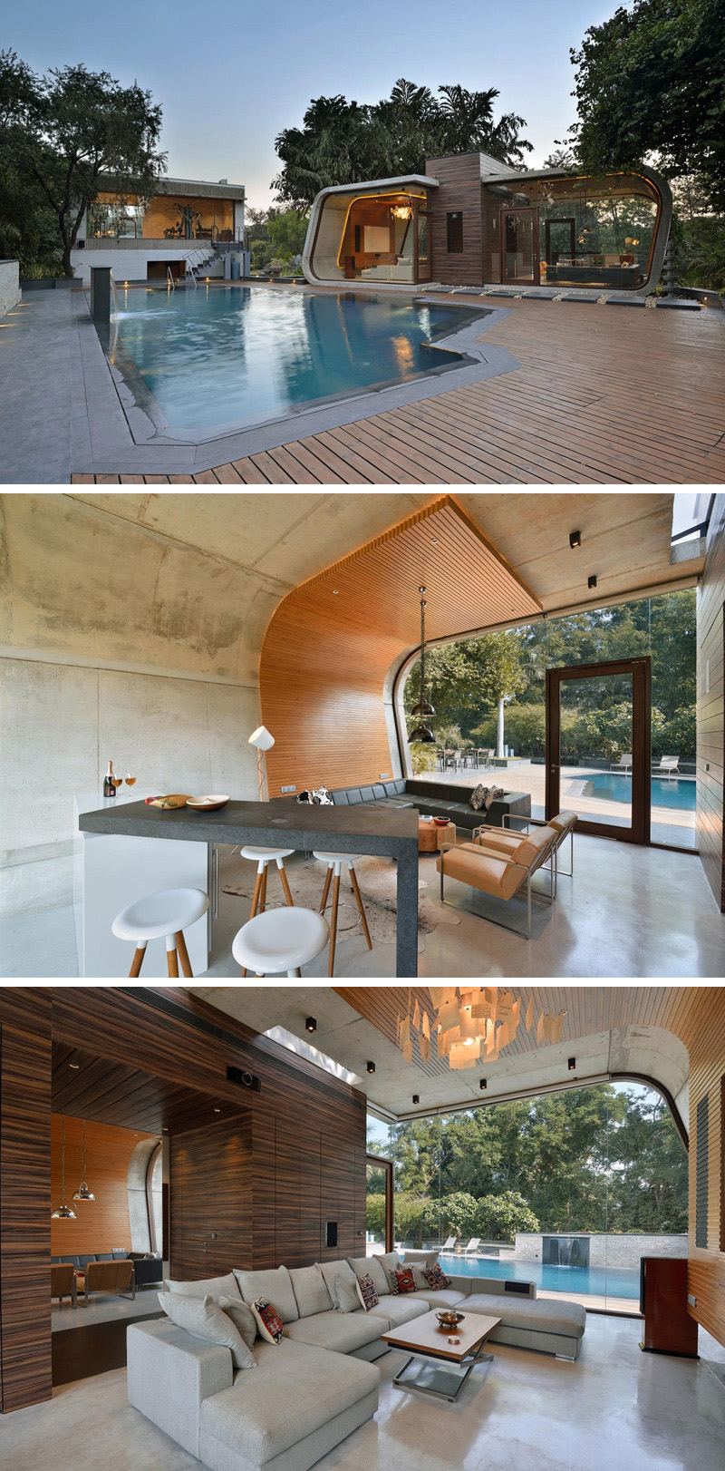 This curved concrete and wood pool house provides plenty of space to relax, and enjoy views of outside through the floor-to-ceiling windows.