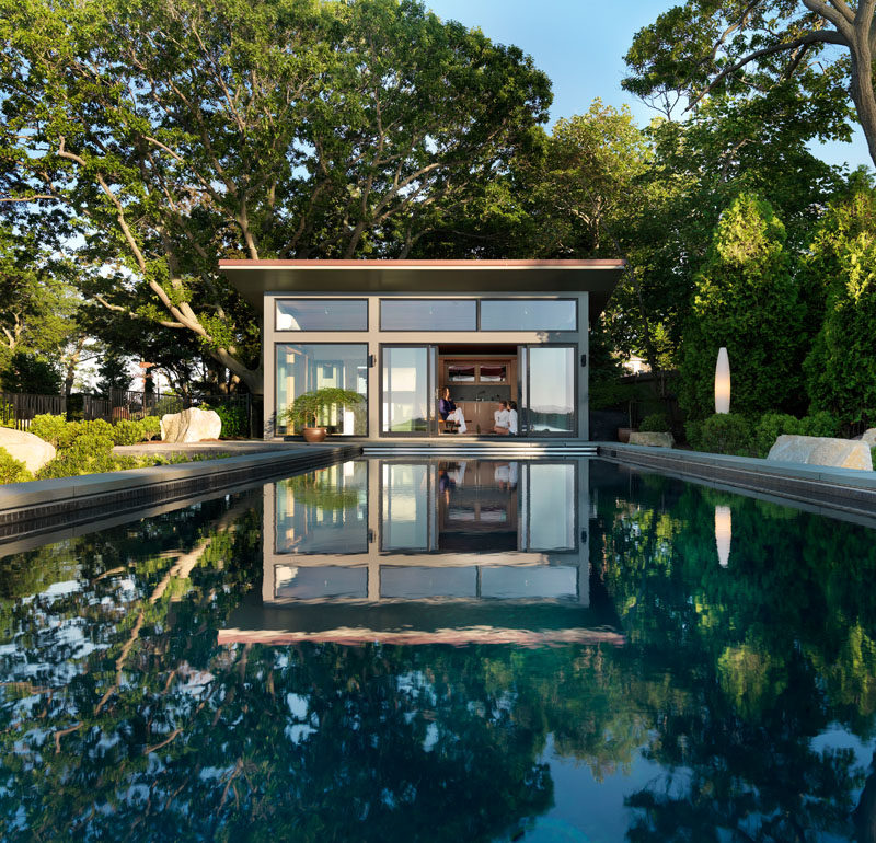 Boston-based Flavin Architects have designed the Eastern Point Retreat, a studio guest house, lap pool and hot tub on the grounds of a 19th century shingle-style home in Gloucester, Massachusetts.