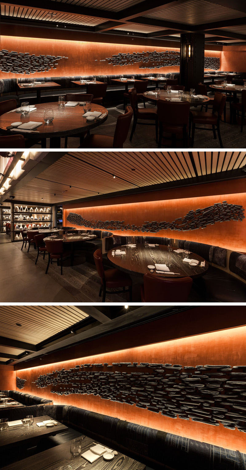 Nobu Downtown (NYC) has a large ceramic art installation along its walls. The installation is made up of 3,500 ceramic pieces that resemble briquettes of charred wood, organized to look like the positive and negative space from the stroke of a large brush.