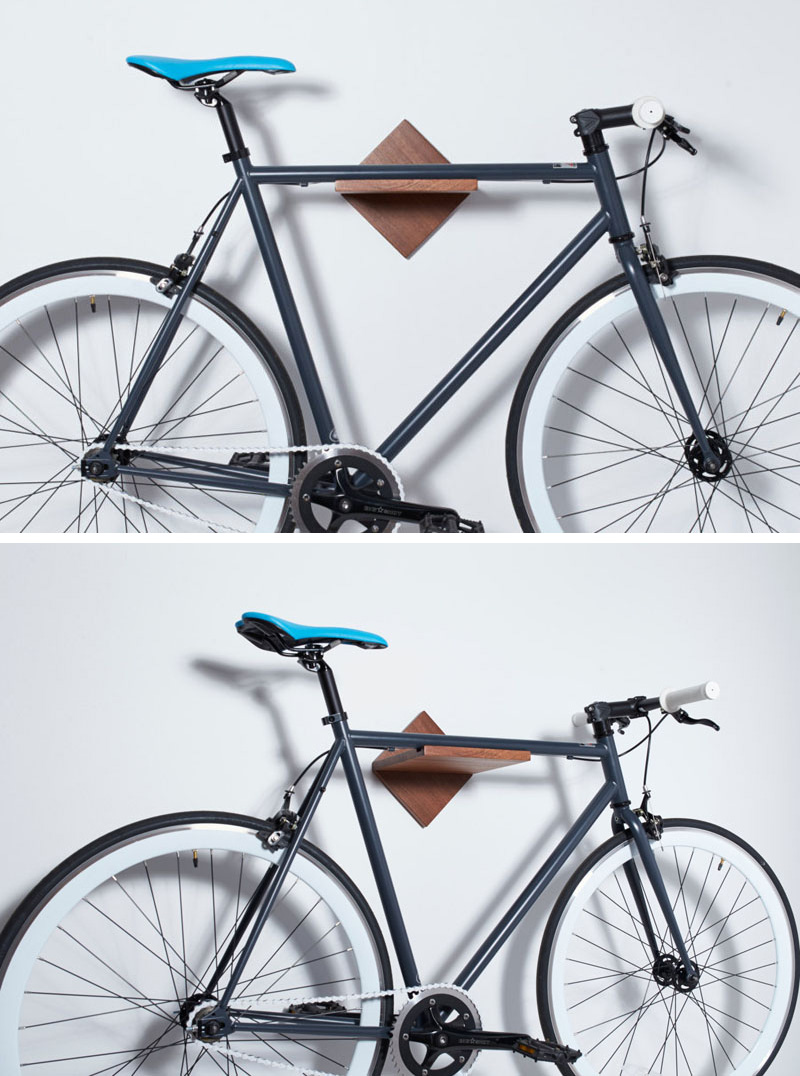  A minimalist wall mounted wood bike rack.