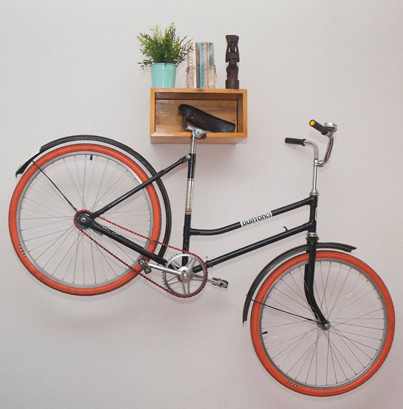 A wood wall mounted bike rack.