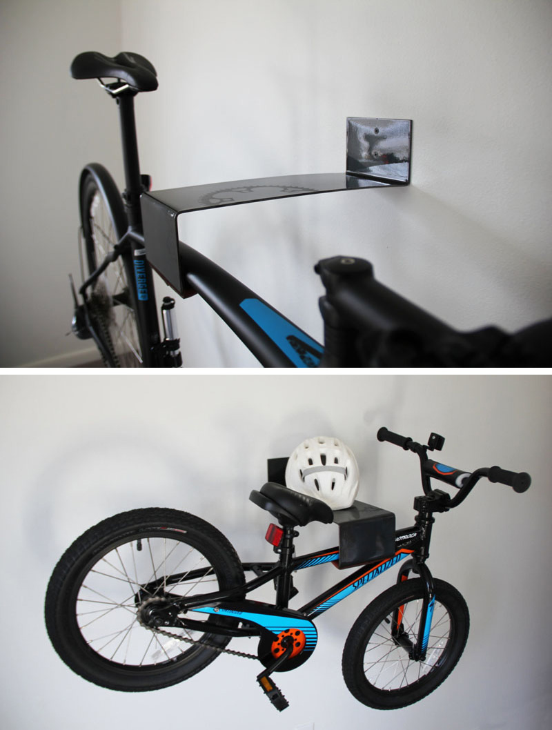 A modern black steel wall mounted bike rack.