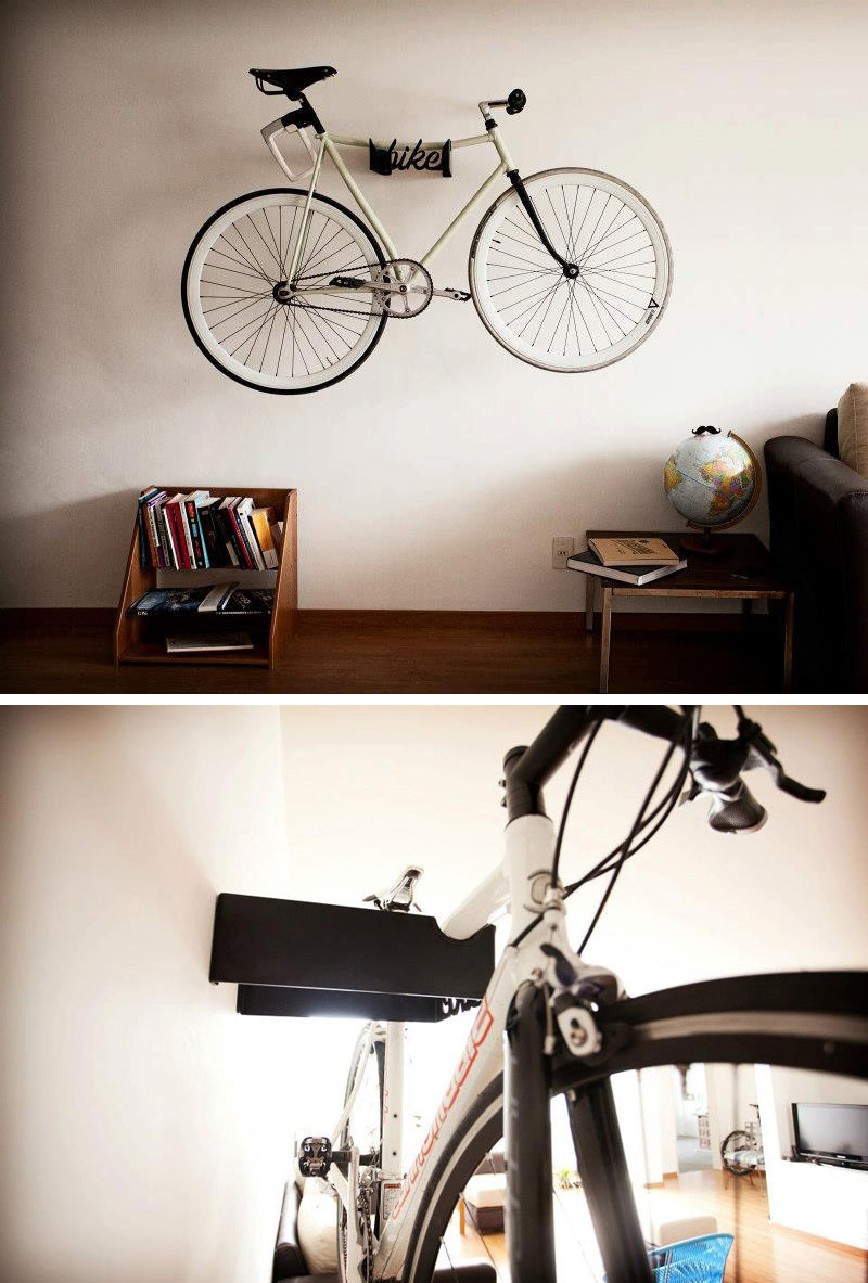 A black steel wall mounted bike rack.