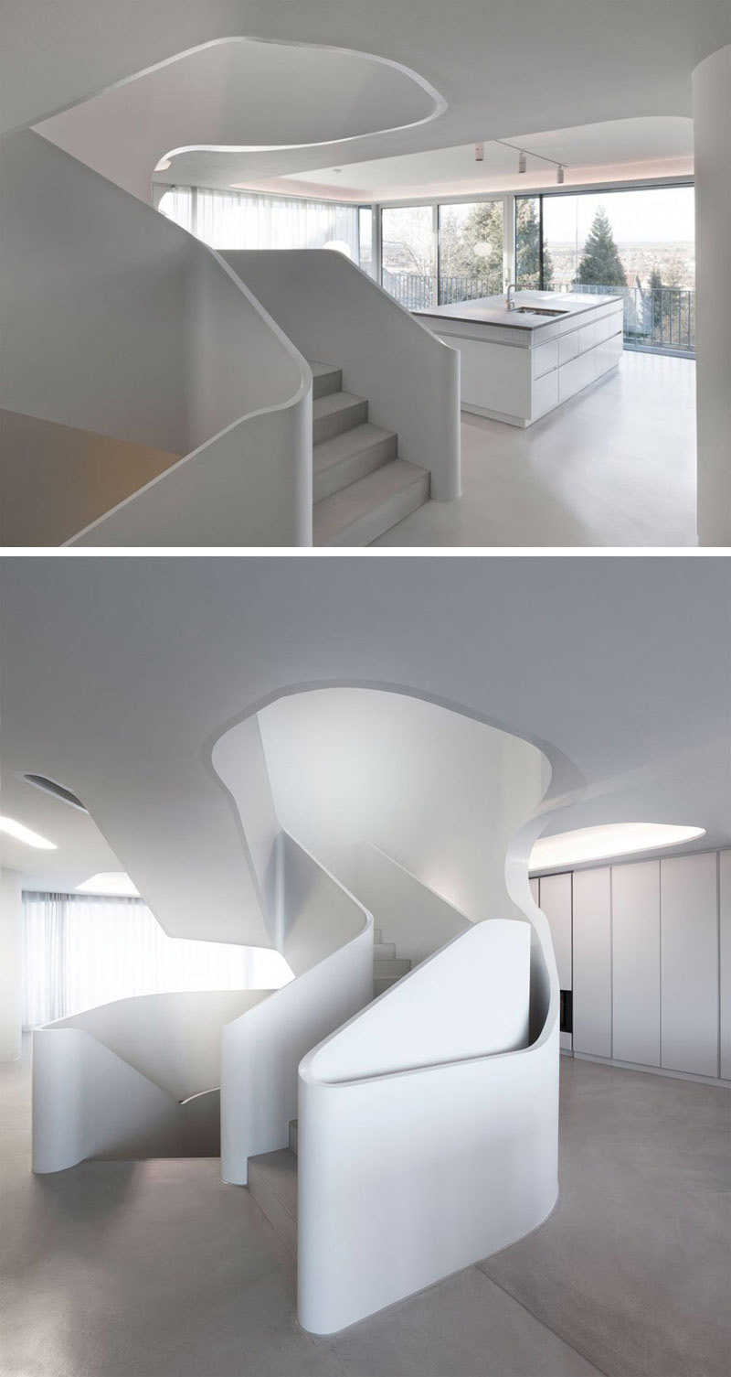 These modern sculptural stairs lead to the third floor of the house. 