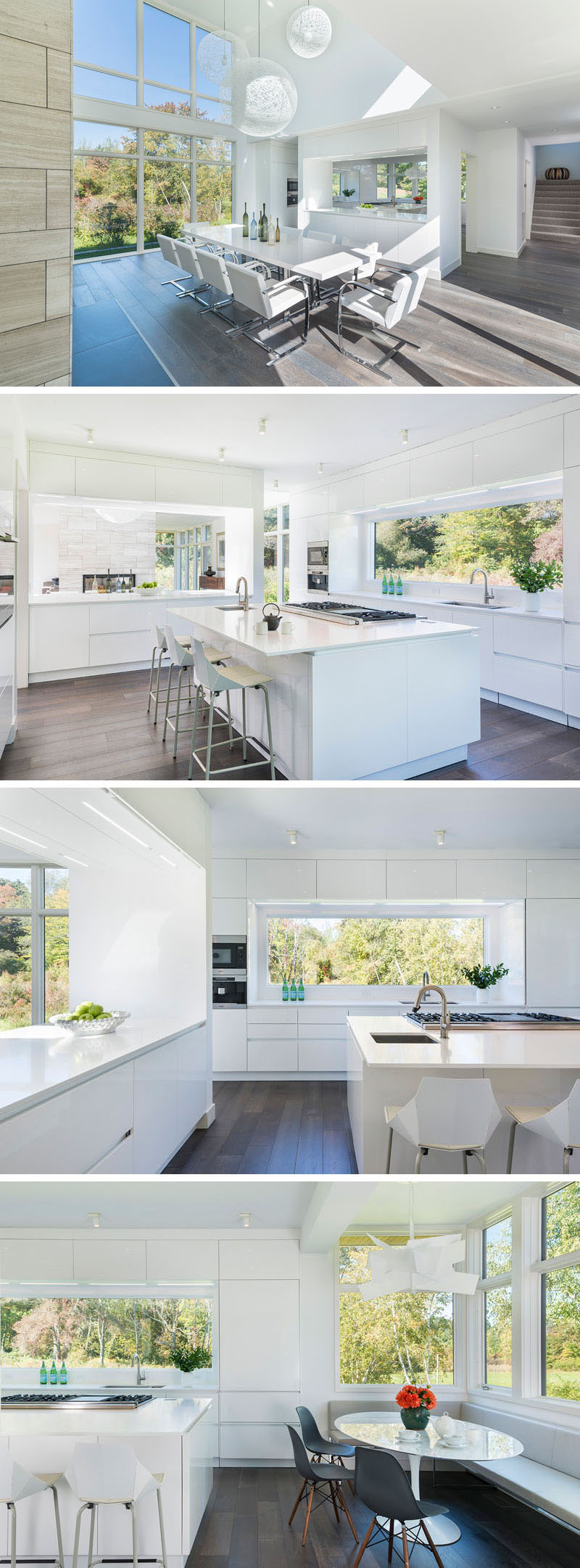A pass-through window provides views from the dining room into this modern all-white kitchen that features a large window above the sink, a central island and a breakfast nook with a built-in corner bench.