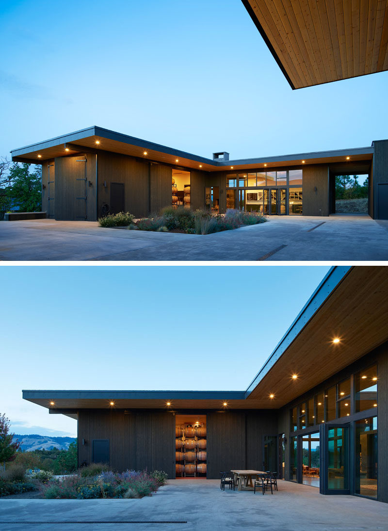 This modern winery has been designed around a central courtyard, with barrel storage rooms and a tasting room opening onto the outdoor space, while 9 foot (2.7m) overhangs provide protection from the elements.