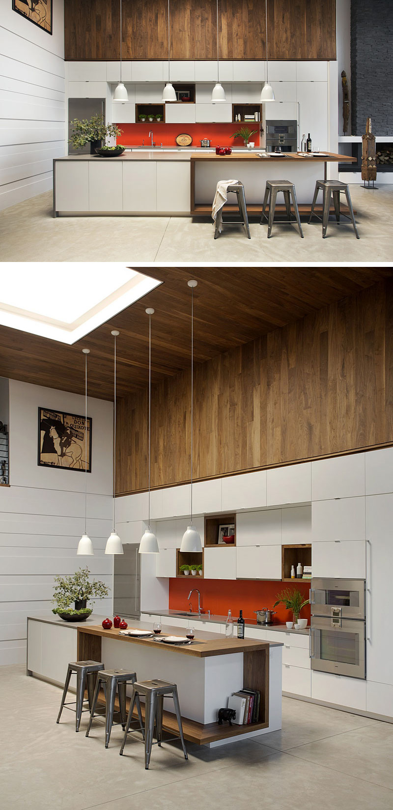 In this modern kitchen four white pendant lights hang above the long wood and white cabinet island that has a slightly raised bar with accompanying stools. A bright orange backsplash adds a pop of color above the sink, while a walnut wood feature above the cabinets wraps around from the wall and up onto the ceiling.