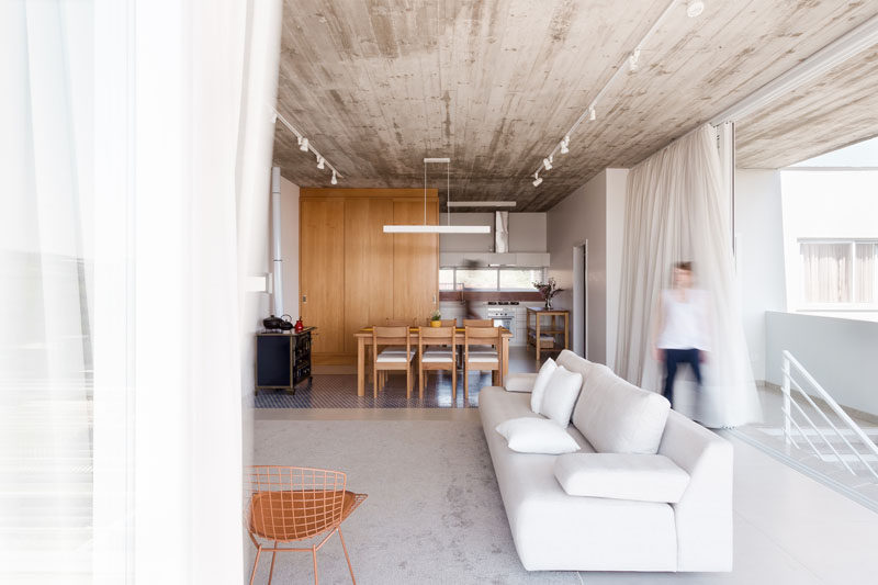 This modern living room opens up to the balcony for an outdoor feeling.