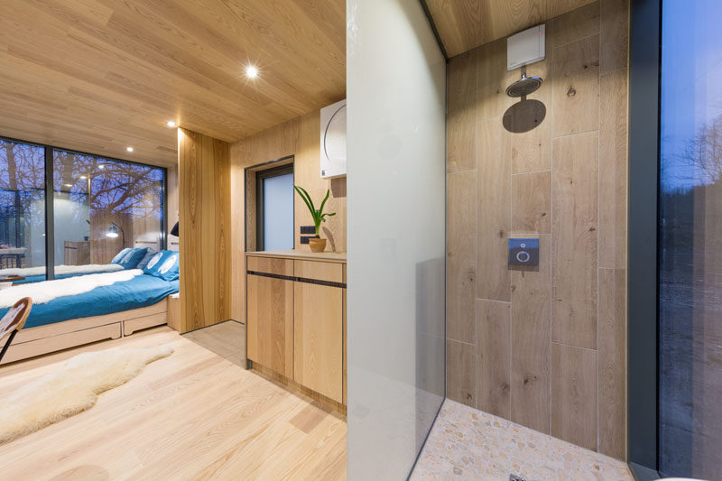 Going into this modern bathroom area, privacy is maintained with the help of opaque glass walls.