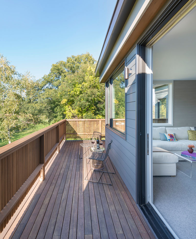 This modern wrap around wood balcony is the perfect place to enjoy a glass of wine and the view.