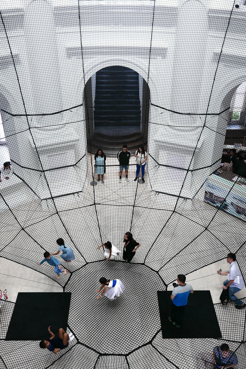 Atelier YokYok have installed a large net within the National Museum of Singapore, that's designed as an inverted dome and allows for visitor interaction.